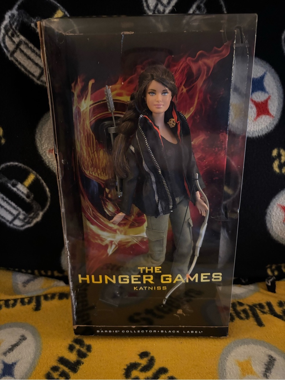 The Hunger Games Katniss Collector Barbie Doll - Black Jacket & Olive Pants.